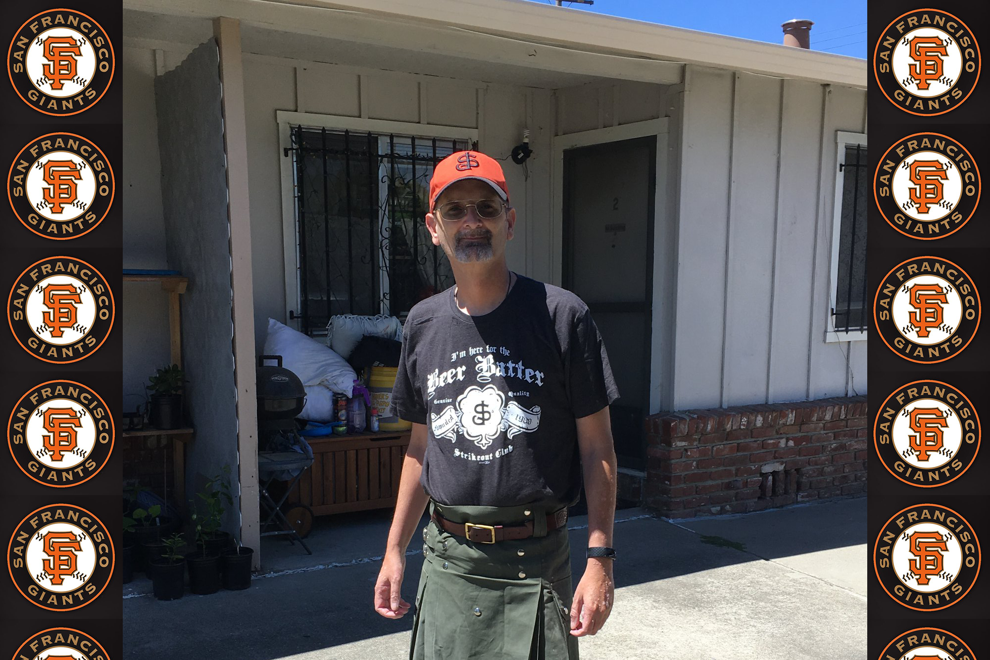 Doug in black shirt, kakhi kilt, and ever-present Giants hat