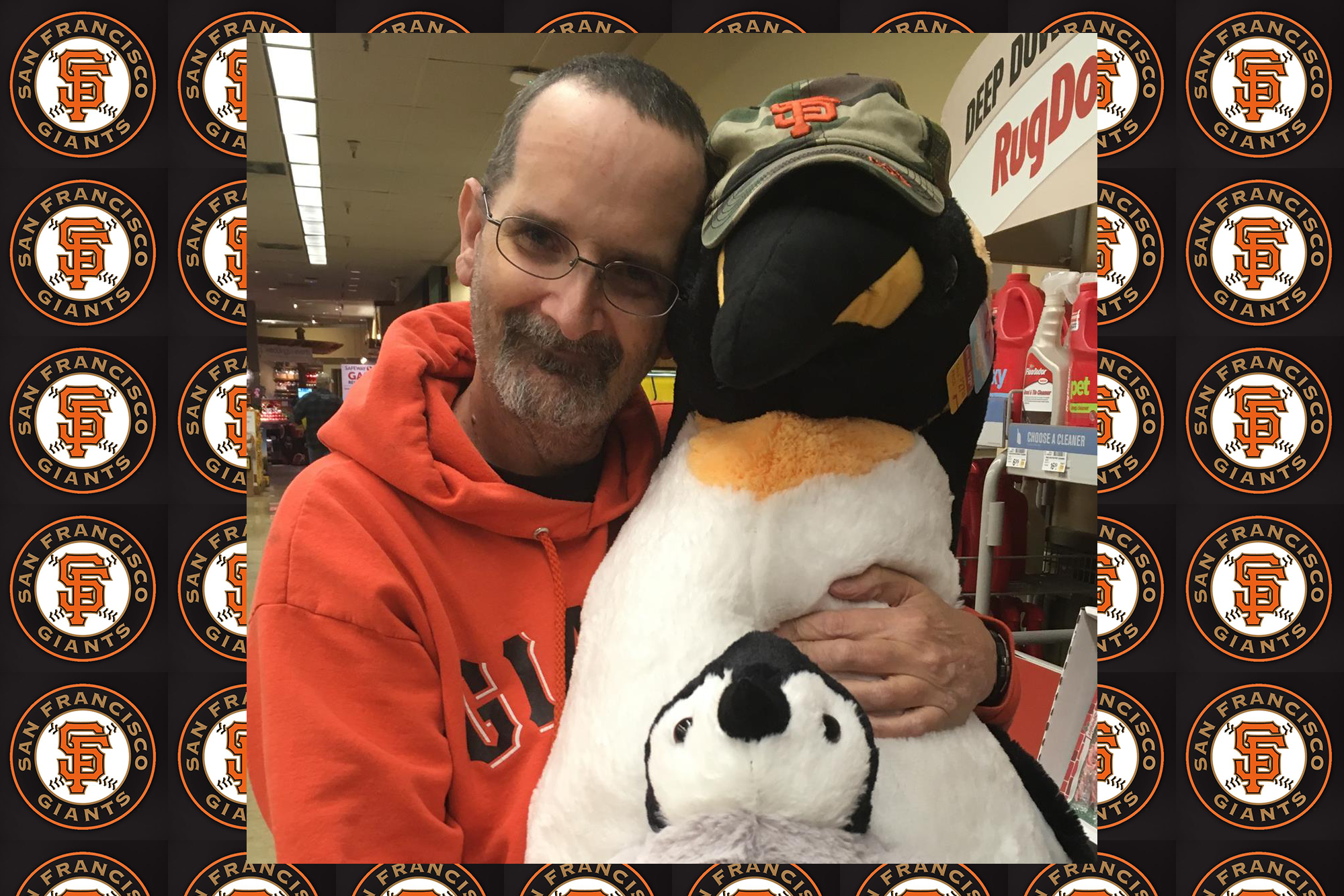 Doug and a plush penguin almost as big as he is